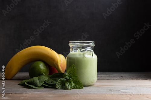 Homemade healthy smoothy made of spinach,banana and apple.