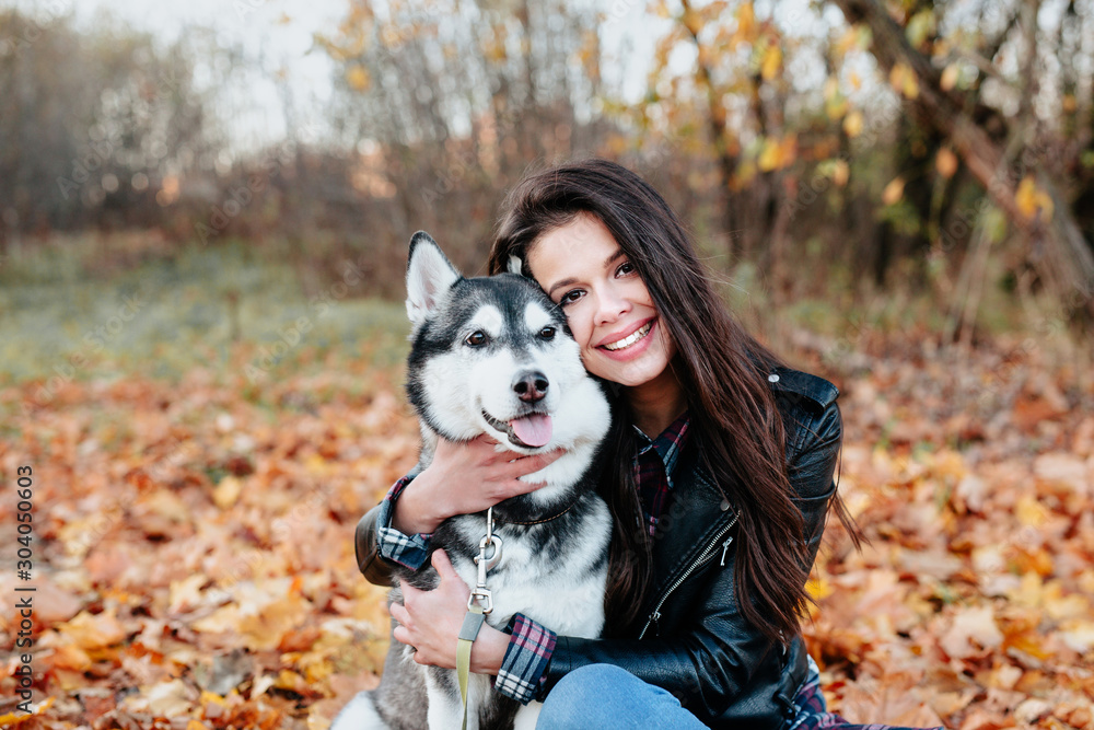 Happy woman hugging pet. Friendship between human and animal Happy woman hugging pet. Friendship between human and animal