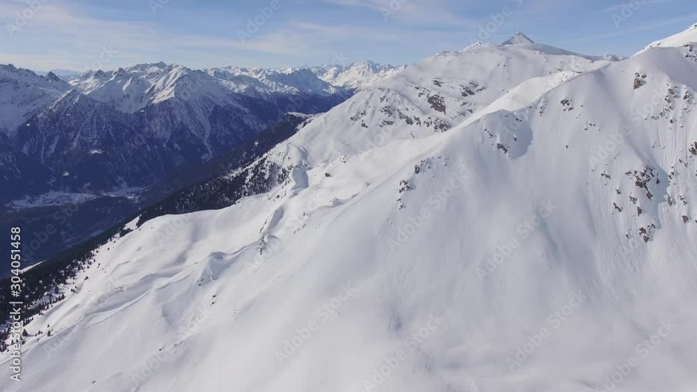 Snowy Swiss Alps. Amazing drone flight over the snowy Swiss mountains, beautiful peaks and ski resorts. Snowy Swiss Alps. Amazing drone flight over the snowy Swiss mountains, beautiful peaks and ski resorts.