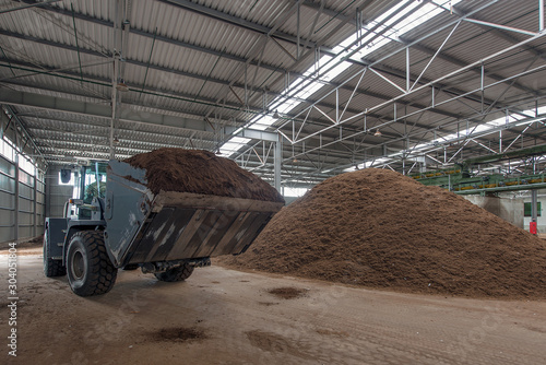 loading of peat raw materials, at the processing plant photo