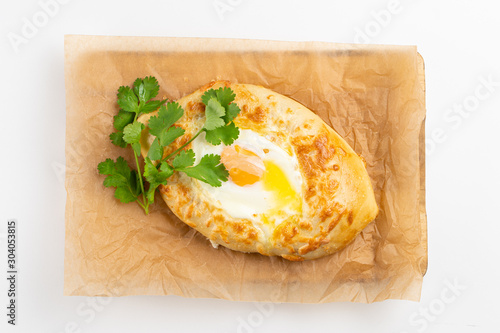 Adjarian khachapuri with egg yolk and cheese isolated on white background