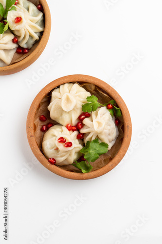 Georgian traditional khinkali with meat and herbs top view isolated on white