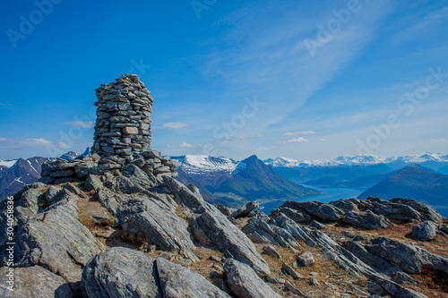 Top of the mountain in Norway with the fjord and mountain behind