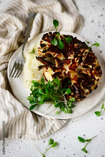 Cauliflower steak with mashed cauliflower with herbs