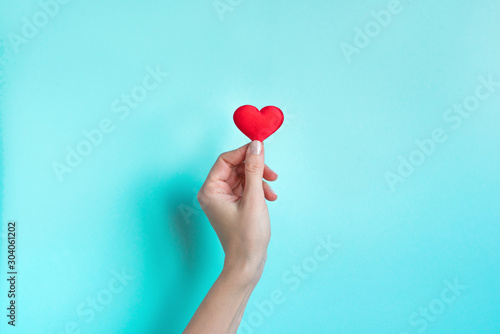 Hand holding Red Heart photo