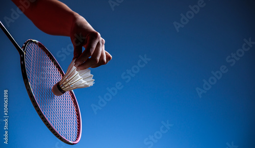 Badminton racket and shuttlecock  in motion closeup photo