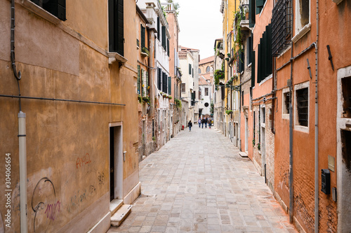 09.10.2019 Venice  Italy  Old shabby streets with walking tourists