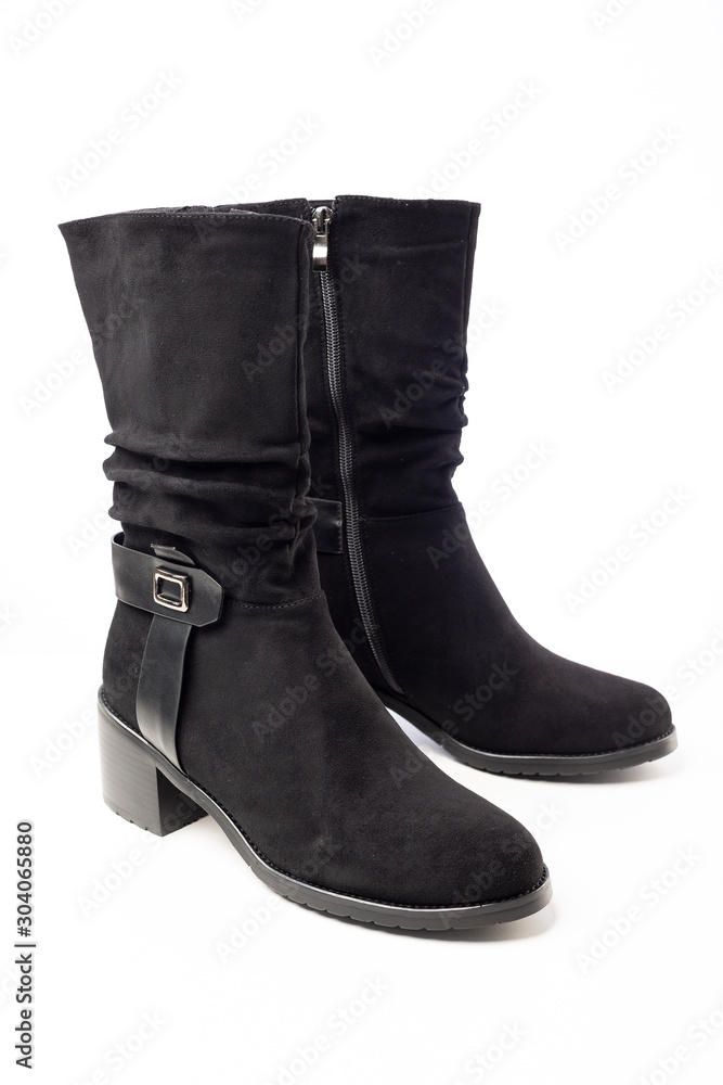 women's black demi-season leather boots on white background