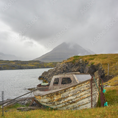 fishing boats on the shore of lake