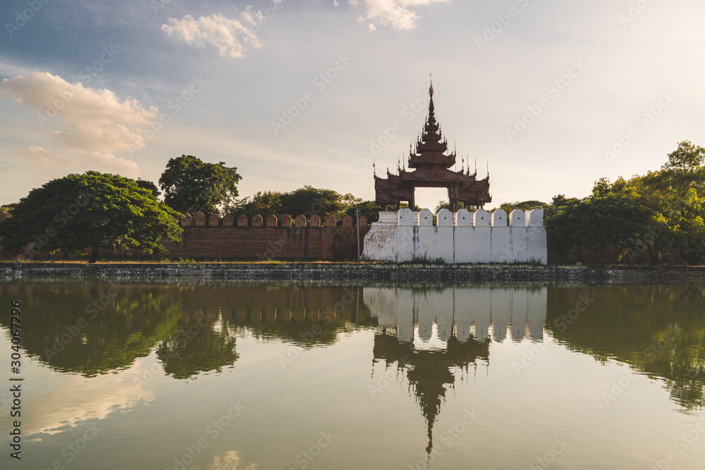 Palace wall with trees reflecting in the water - Mandalay Palace, Myanmar Palace wall with trees reflecting in the water - Mandalay Palace, Myanmar