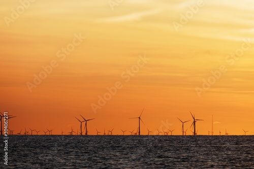 Windfarm on the sea at sunset