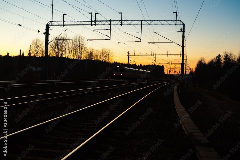 Kouvola, Finland - 15 November 2019: Train and railway at beautiful sunset background.