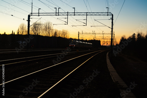 Kouvola, Finland - 15 November 2019: Train and railway at beautiful sunset background.