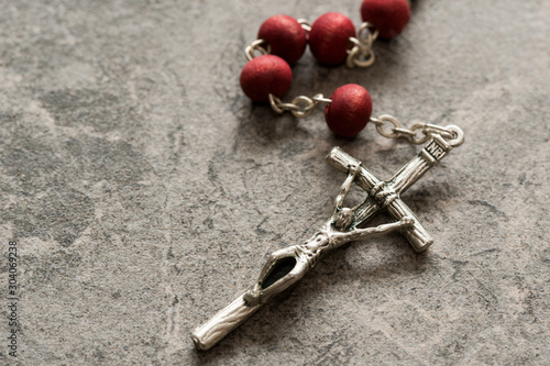 Rosary on the stone background close-up view