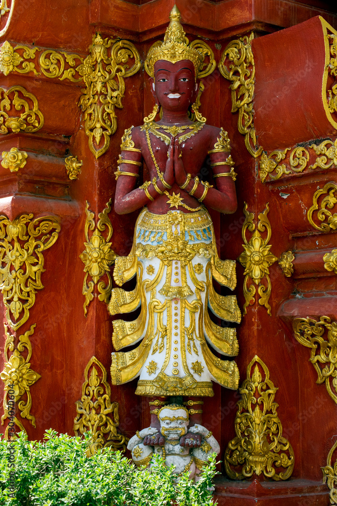 Statue in garden at Wat Ming Mueang, Chiang Rai, Thailand