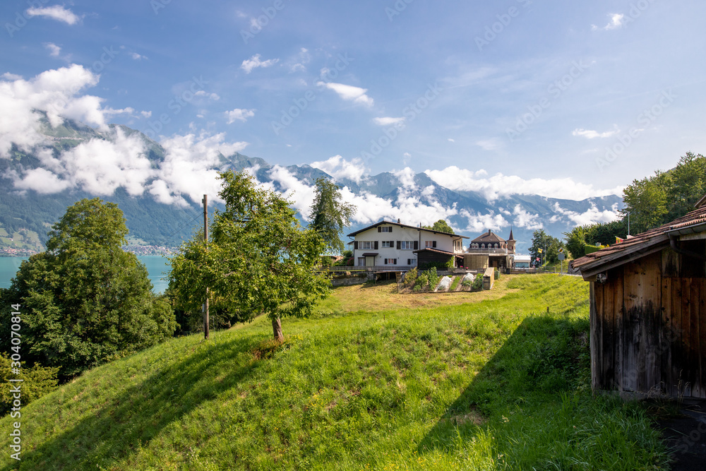 The local Swiss houses with Alps landscape , Switzerland
