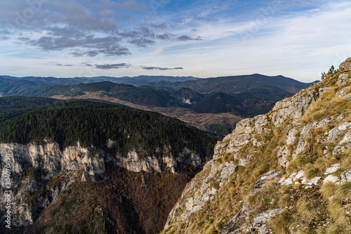 Aerial view of hills in Rhodope mountains with cloudy skies during the autumn 