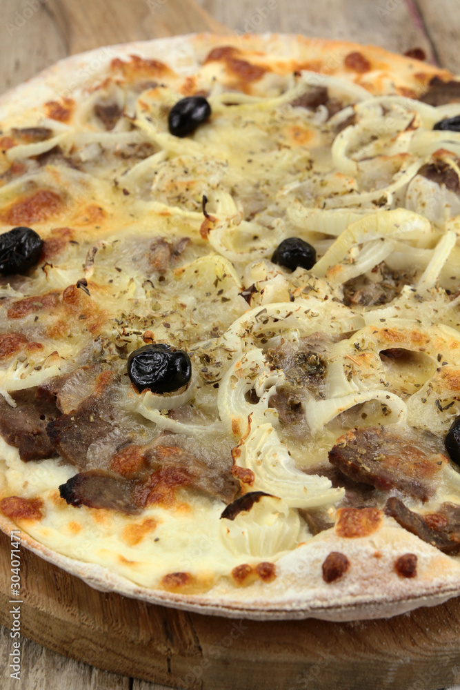 pizza with kebab and mozzarella on a wooden table pizza with kebab and mozzarella on a wooden table