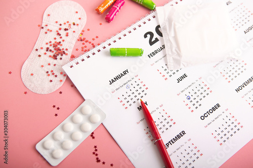 Medical female tampon on a pink background.