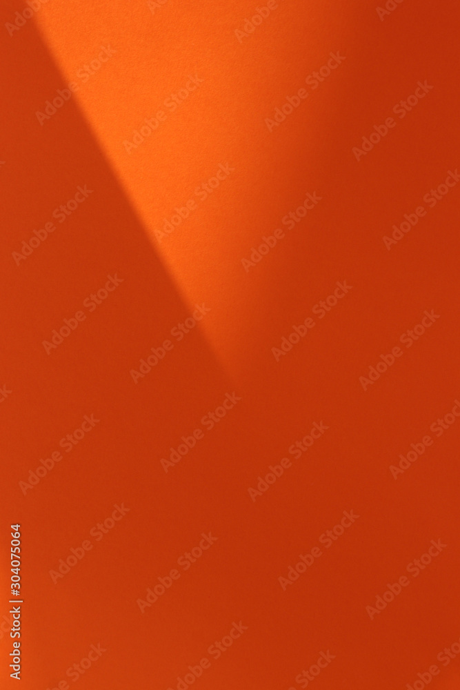 Beautiful orange background with light and shadow effects. Trend concept. Empty background.