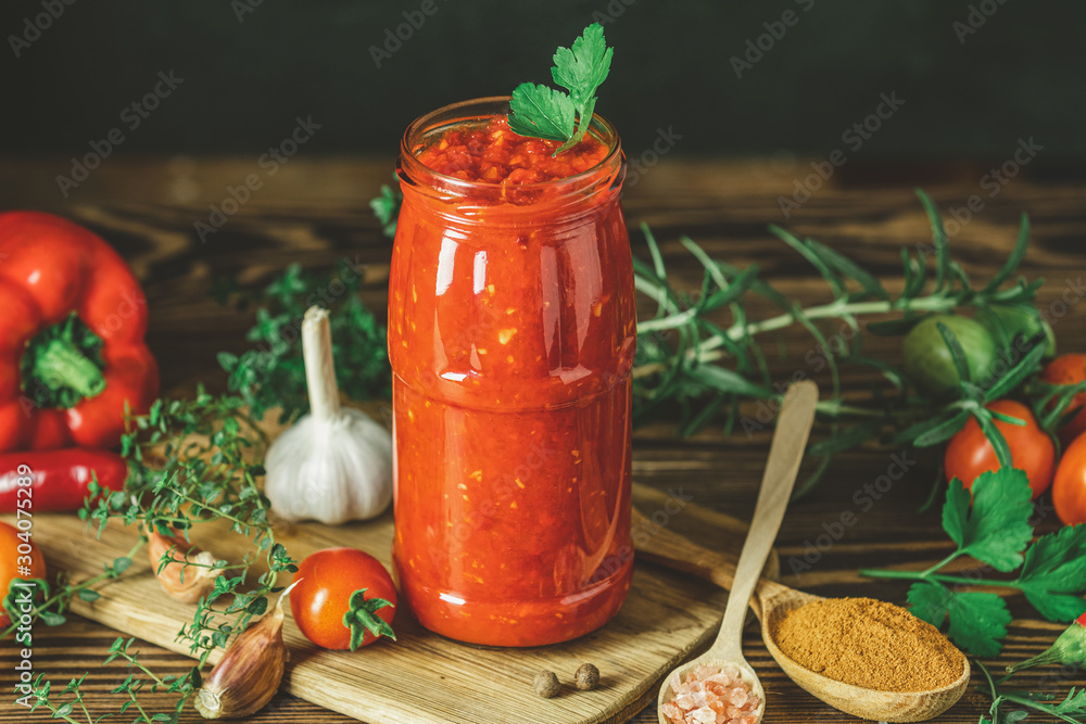 Homemade DIY natural canned hot tomato sauce chutney with chilli or adjika Homemade DIY natural canned hot tomato sauce chutney with chilli or adjika