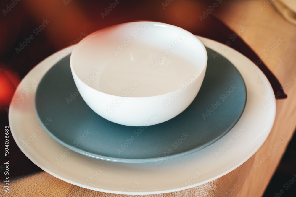 Tableware on kitchen table with autumn decor close up Tableware on kitchen table with autumn decor close up