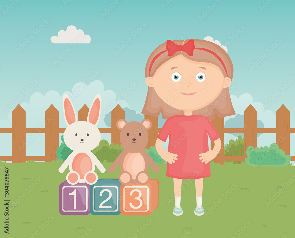 Fototapeta premium cute girl with blocks rabbit and bear park, kids toys