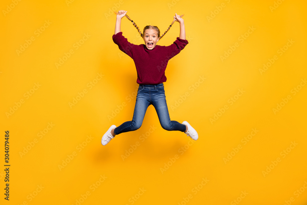 Full length body size view of her she nice attractive crazy girlish cheerful cheery pre-teen girl jumping having fun free time fooling isolated on bright vivid shine vibrant yellow color background