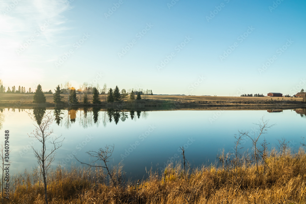 Beautiful autumn landscape of Kymijoki river waters at sunset. Finland, Kymenlaakso, Kouvola Beautiful autumn landscape of Kymijoki river waters at sunset. Finland, Kymenlaakso, Kouvola