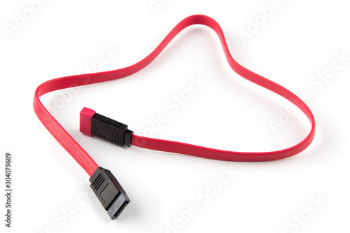 Red sata 3 computer cable closeup isolated on white background photo