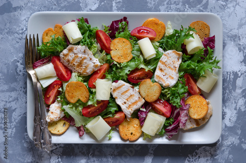 Caesar salad with croutons cheese and chicken