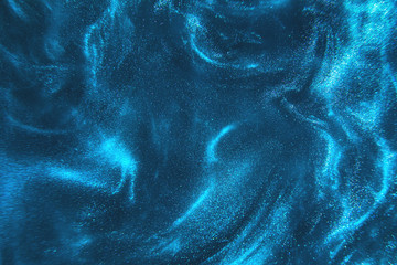 Abstract elegant, detailed blue glitter particles flow with shallow depth of field underwater. Holiday magic shimmering underwater space luxury background. Festive sparkles and lights. de-focused.