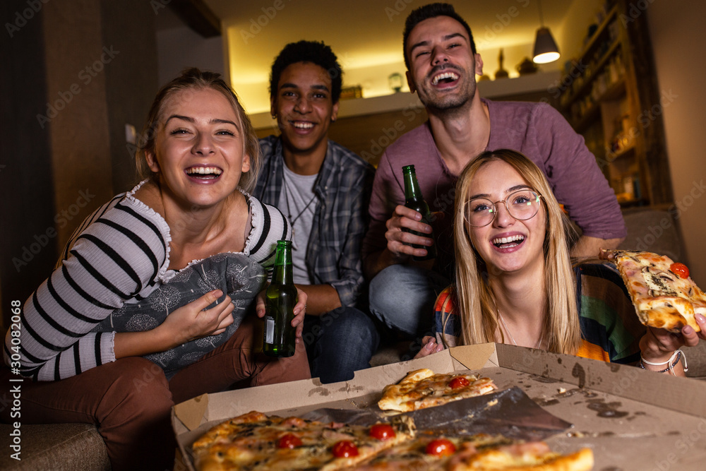 Group best friends sitting at home watching a comedy movie .Watching tv show. Group best friends sitting at home watching a comedy movie .Watching tv show.