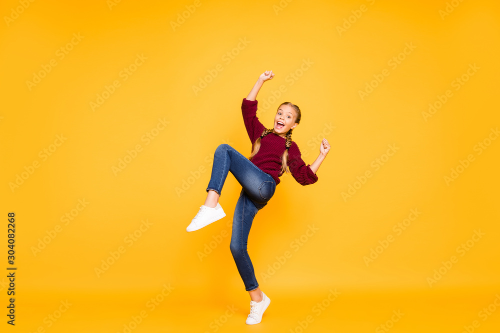 Full length body size view of her she nice attractive lovely girlish glad cheerful cheery pre-teen girl having fun rejoicing win winner isolated on bright vivid shine vibrant yellow color background