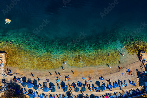 beach of the Greek island of Simi with rocks and clear water view from drone