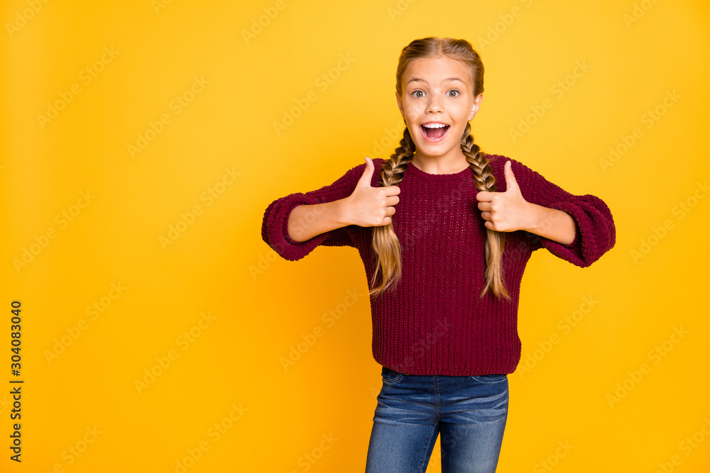 Portrait of her she nice attractive lovely girlish cheerful cheery glad pre-teen girl showing two double thumbup ad advert isolated on bright vivid shine vibrant yellow color background Portrait of her she nice attractive lovely girlish cheerful cheery glad pre-teen girl showing two double thumbup ad advert isolated on bright vivid shine vibrant yellow color background