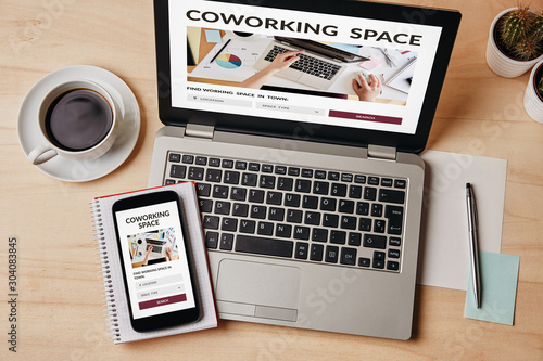 Coworking space concept on laptop and smartphone screen