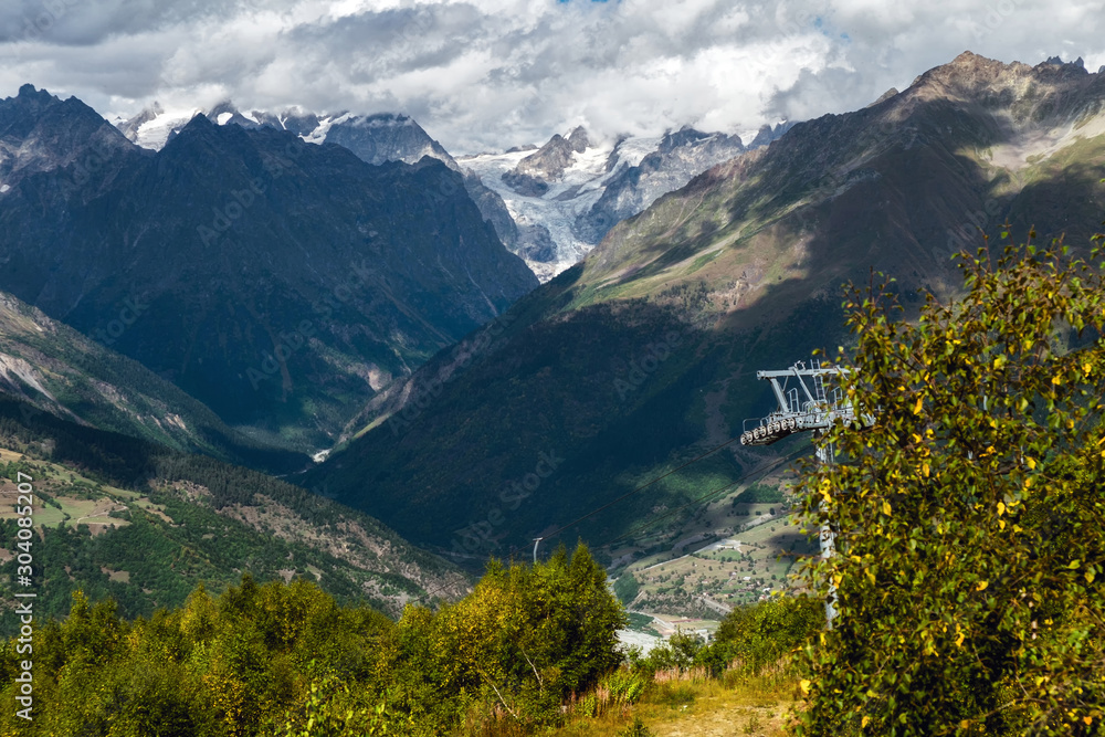 ropeway down from Hatsvali Ski resort to Mestia with mountain Shkhara and its glacier on background