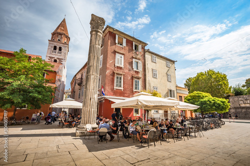 Beautiful panoramic view of idyllic scenery in the ancient roman city center of Zadar with historic church of St. Simeon on a beautiful sunny day with blue sky and clouds in summer, Dalmatia, Croatia