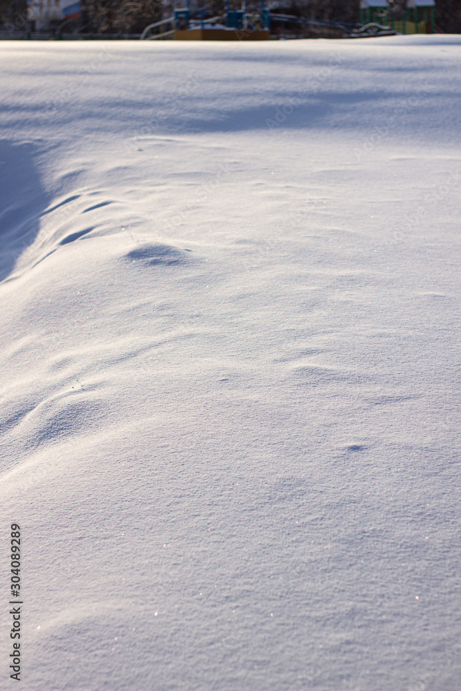 many tracks on the glade covered with snow, paths in the snow, snow-covered meadow many tracks on the glade covered with snow, paths in the snow, snow-covered meadow