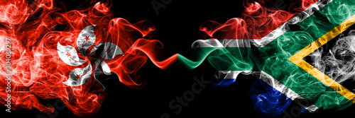 Hong Kong, China vs South Africa, African smoky mystic states flags placed side by side. Concept and idea thick colored silky abstract smoke flags photo