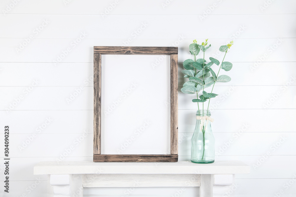 Mockup of a rough wooden frame on a white wall background in the interior - obrazy, fototapety, plakaty 