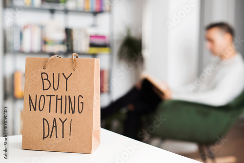 Photography text buy nothing day in a shopping bag.