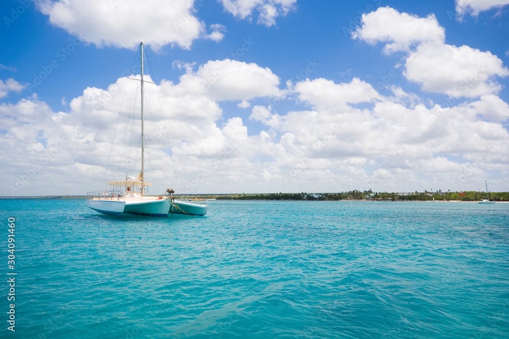 Luxury yacht anchored on turquoise water of Caribbean Sea, Dominican Republic