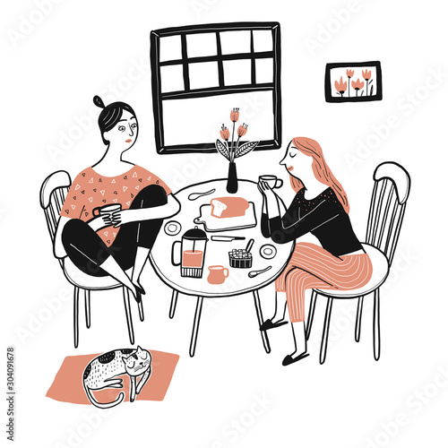 A beautiful woman sitting and eating breakfast