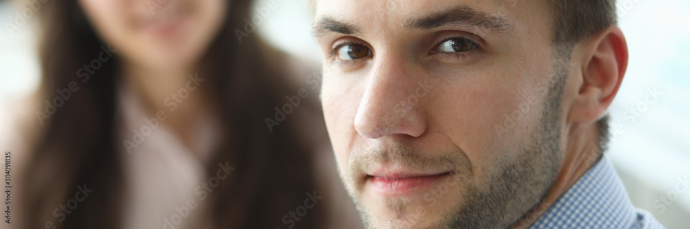 Portrait of bearded male worker sitting in company office and looking at camera with calmness. Smiling man discussing important business agreement. Biz meeting concept. Blurred background Portrait of bearded male worker sitting in company office and looking at camera with calmness. Smiling man discussing important business agreement. Biz meeting concept. Blurred background