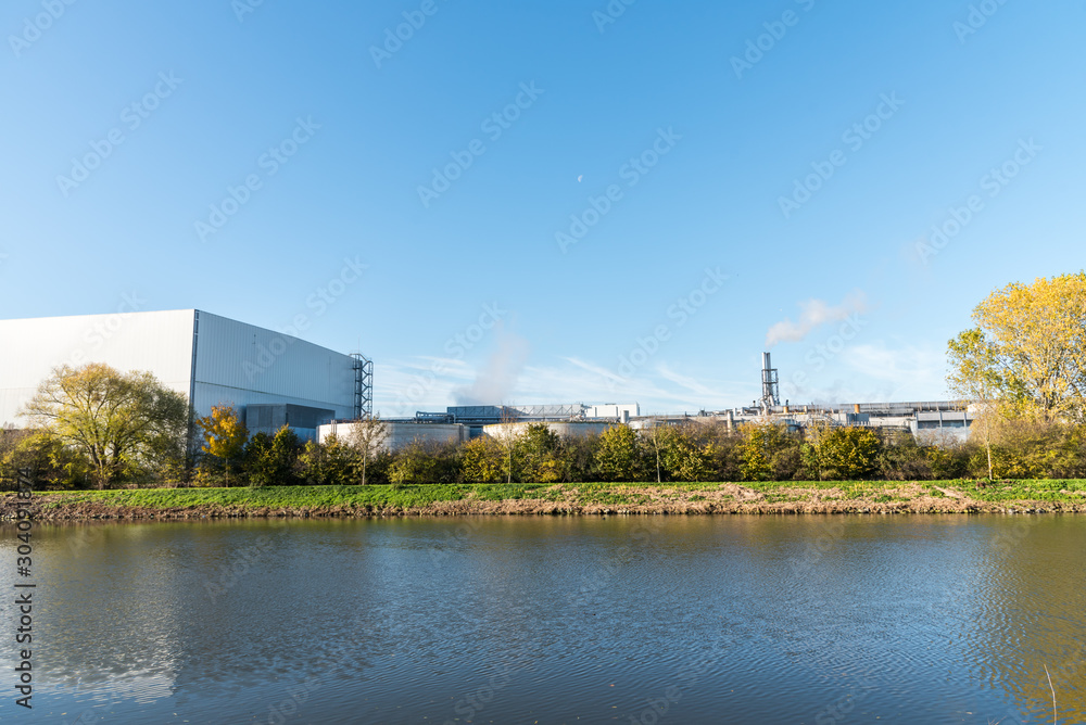 Fototapeta premium Big industrial warehouse in nature