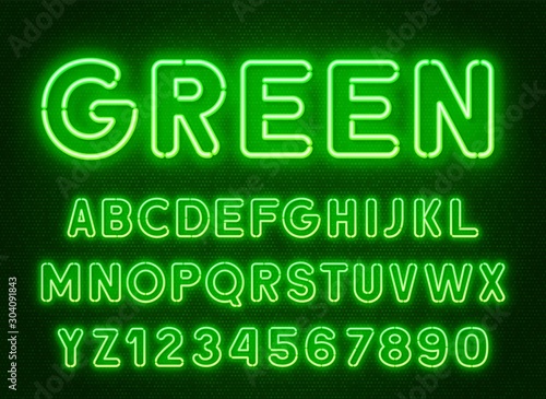 Neon rounded green font  glowing alphabet with numbers. on a dark background.