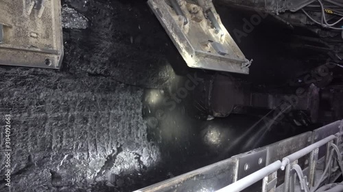Underground coal mining. The work of the harvester in the longwall.
