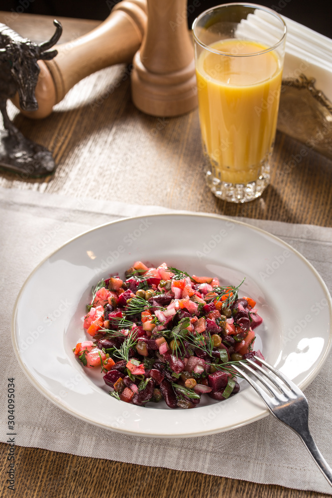 beetroot salad vinaigrette with red bean on white plate on fabric napkin on the table beetroot salad vinaigrette with red bean on white plate on fabric napkin on the table